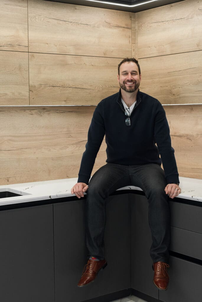 Custom cabinet building business owner smiling for brand photo for website