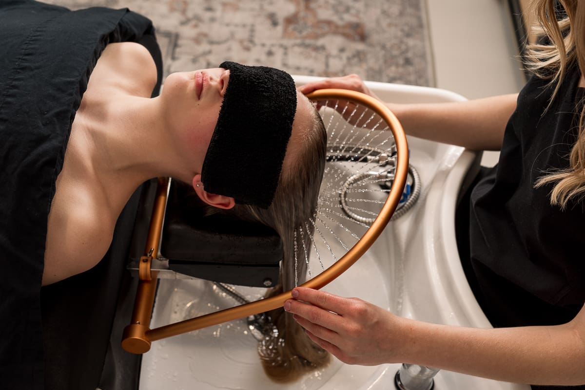 Brand photo of a client receiving the Japanese head spa treatment.