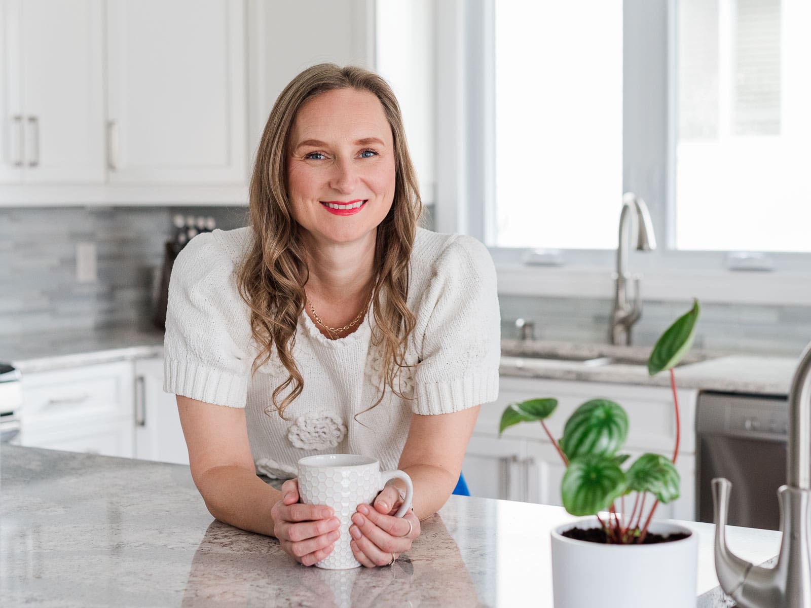 Confident female entrepreneur in home space representing how to find your brand vibe in a real setting